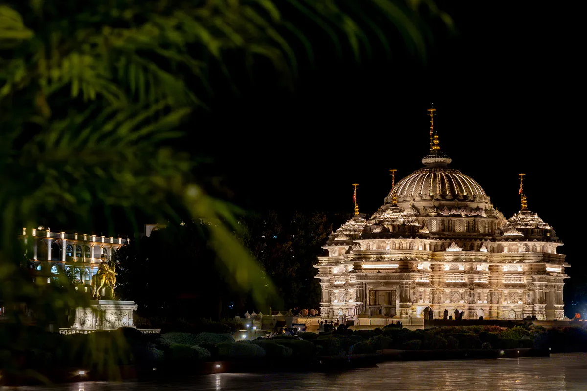 The mandir dome lit at night