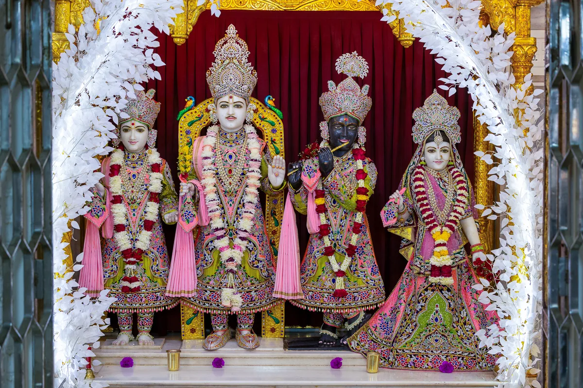 Murtis of the mandir, adorned in flowers