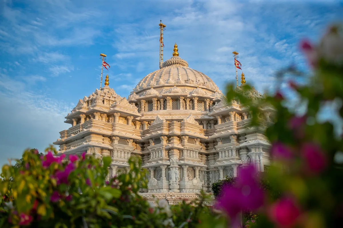 The mandir dome among bougainvillea